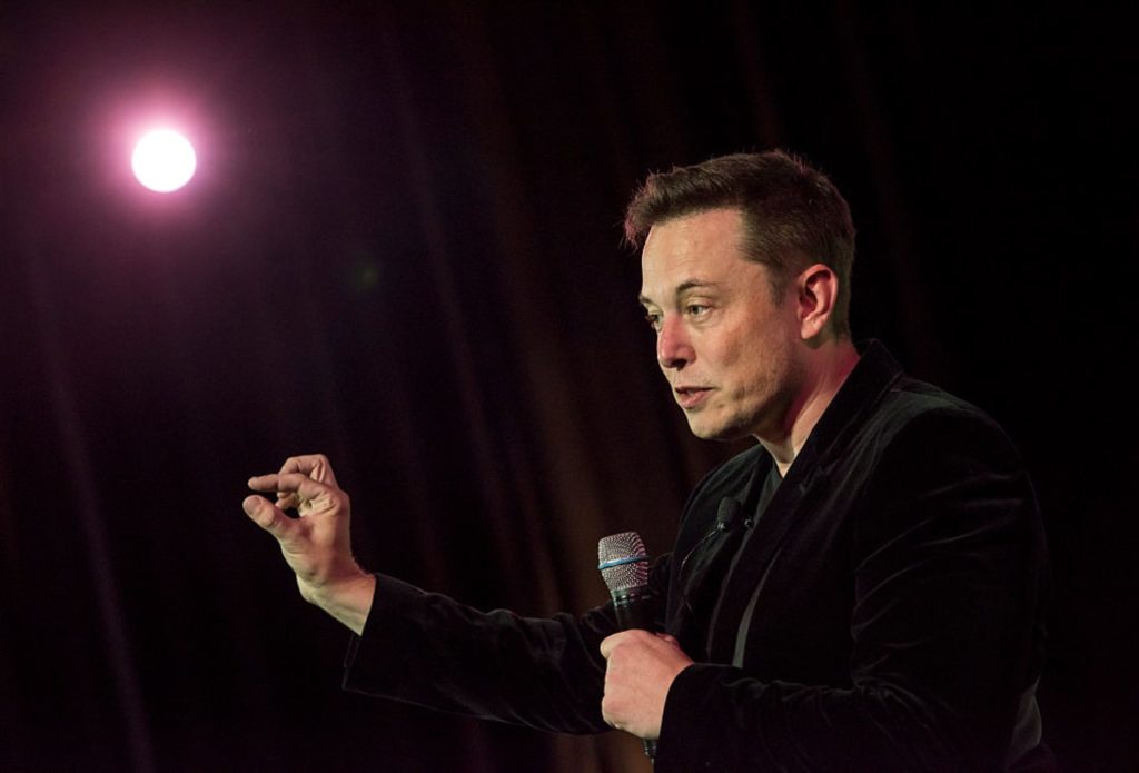 Elon Musk gives speech in example photo